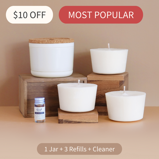 Set of candles and refills on wooden stands with promotional text on a beige background