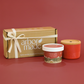 Two candles and a box with 'arbor made' branding on a red background